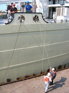 Linehandlers assisting a vessel through the Soo Locks